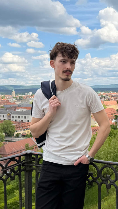 Vintage White — The Standard T-Shirt above the city