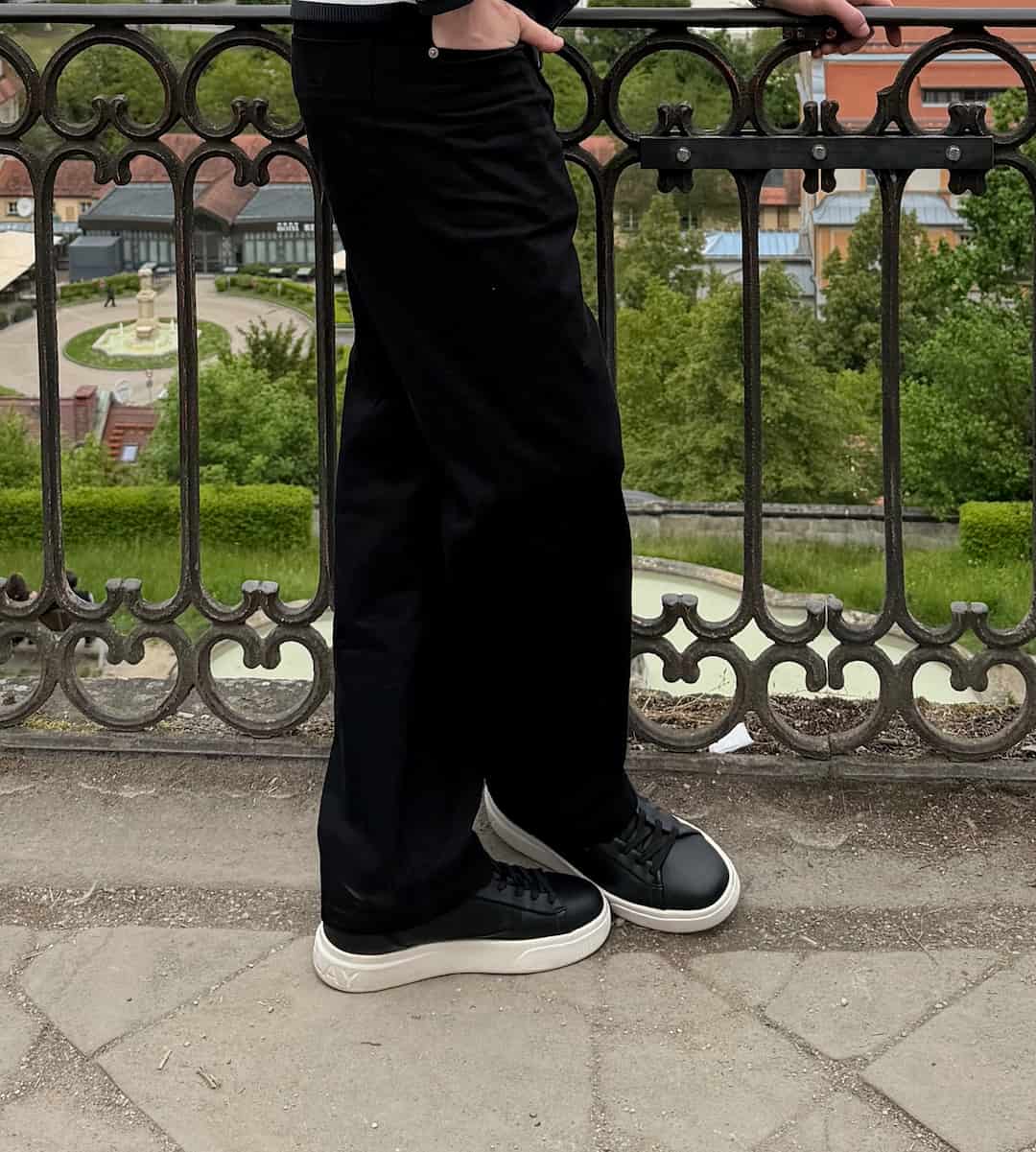 Relaxed – Black — The Standard Trousers by the railing