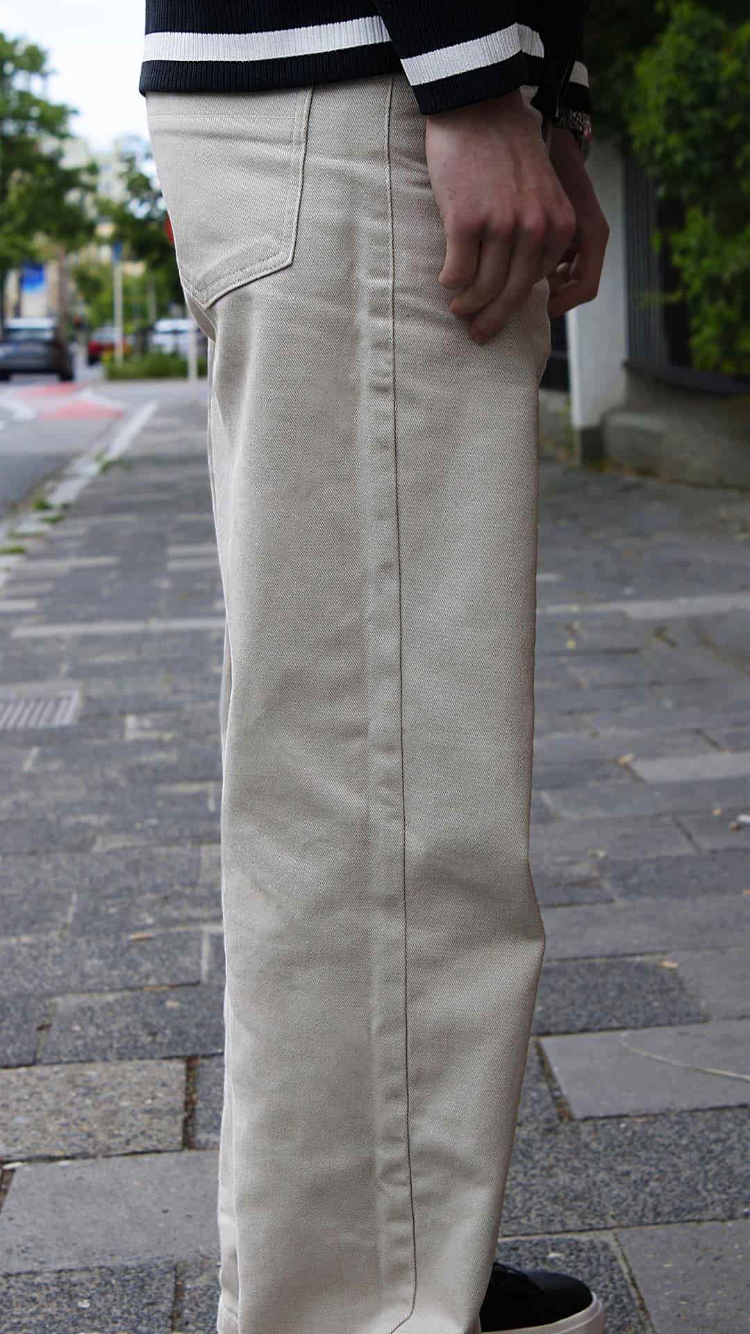 The Standard Trousers in pale khaki — fabric and drape up close